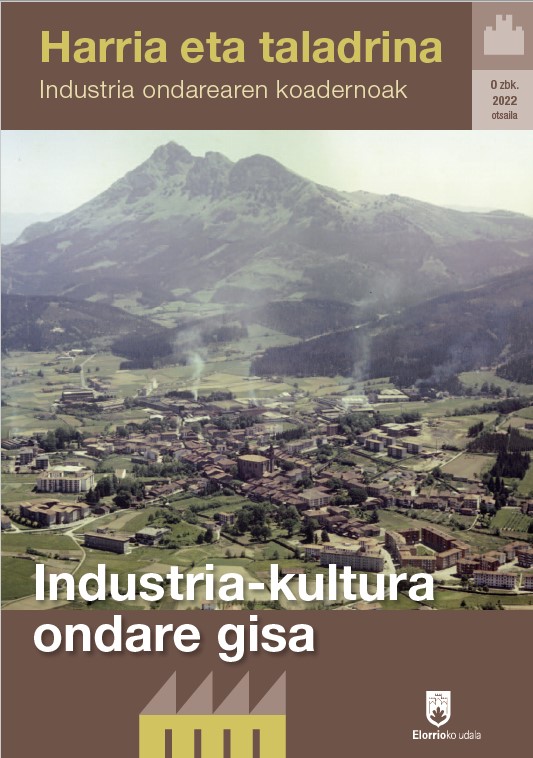 Portada de la revista Piedra y Taladrina en su versión en euskera. La imagen central es una vista aérea de un pueblo (Elorrio) rodeado de montes.